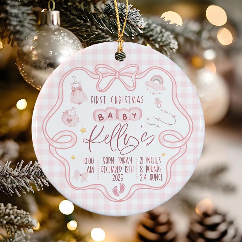 A round white ceramic ornament with a pink gingham border and a gold hanging string.