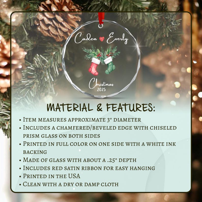 A circular glass Christmas ornament with a beveled edge, measuring 3 inches in diameter and 0.25 inches in depth. It features a red satin ribbon, a red heart, two stockings, and the text Caden Everly Christmas 2025.