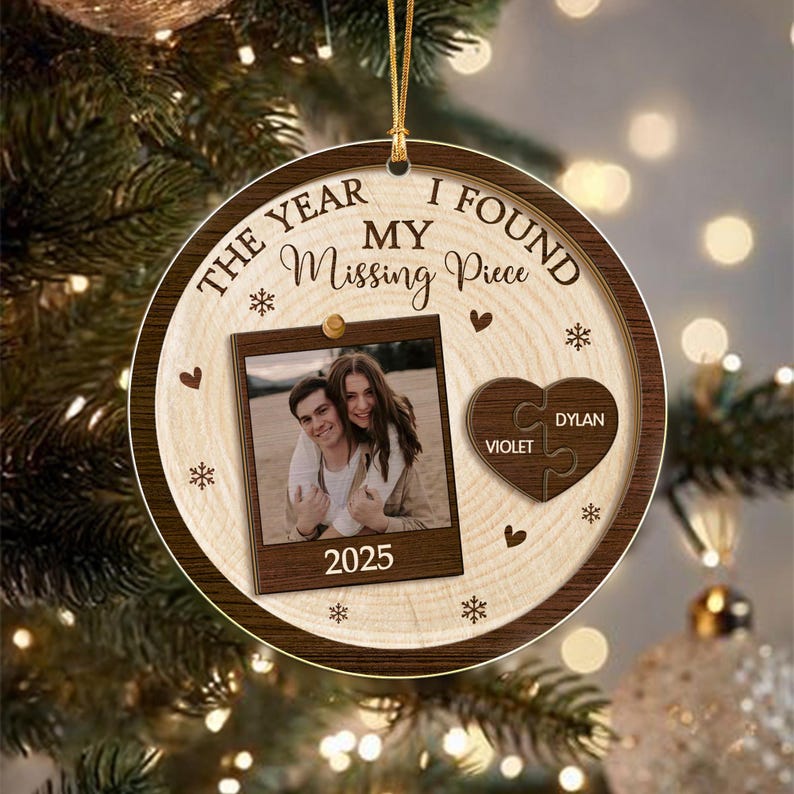 A round wooden Christmas ornament featuring a light wood grain center and dark brown border.