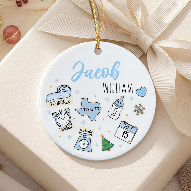 A round white ceramic ornament featuring the name Jacob William in blue and black text.