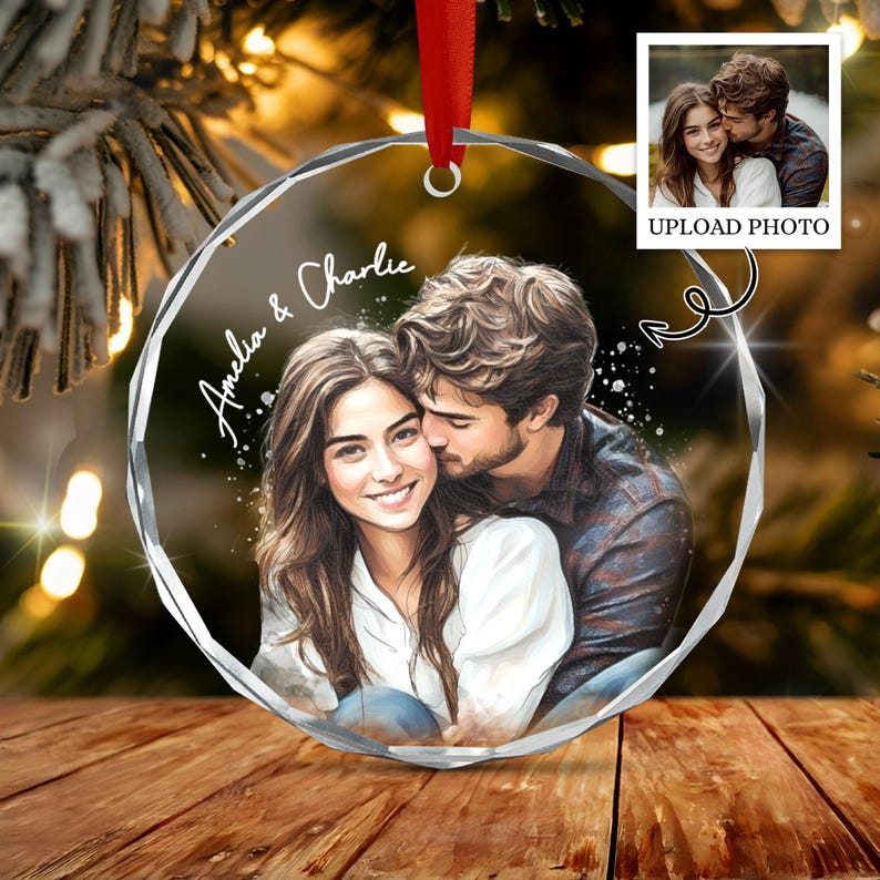 A circular crystal ornament featuring a printed illustration of a couple embracing, with the text Amelia & Charlie.
