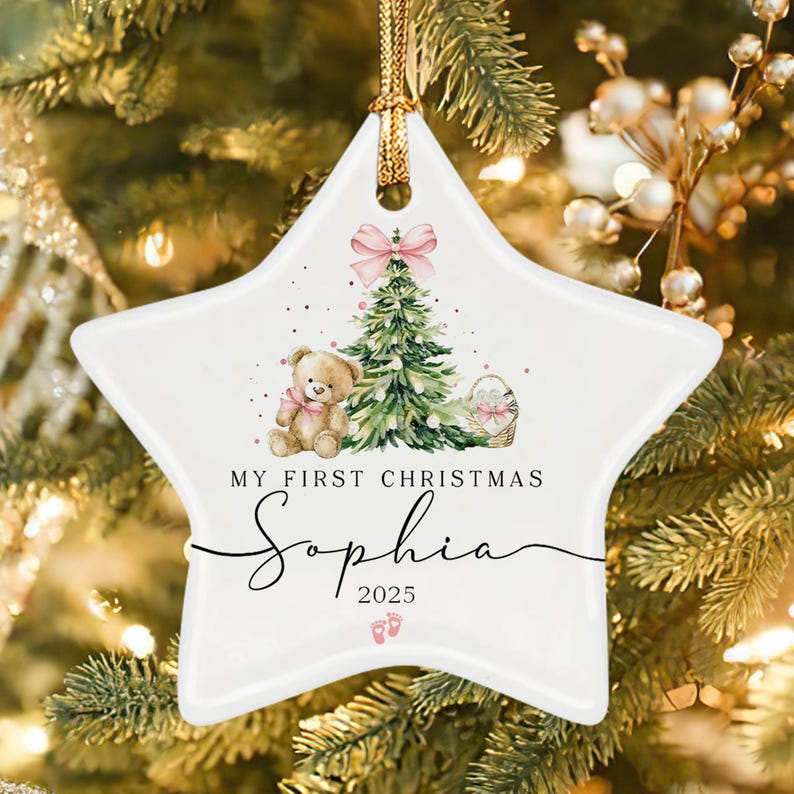 A white star-shaped ceramic ornament featuring a watercolor illustration of a teddy bear, a Christmas tree with a pink bow, and a basket.