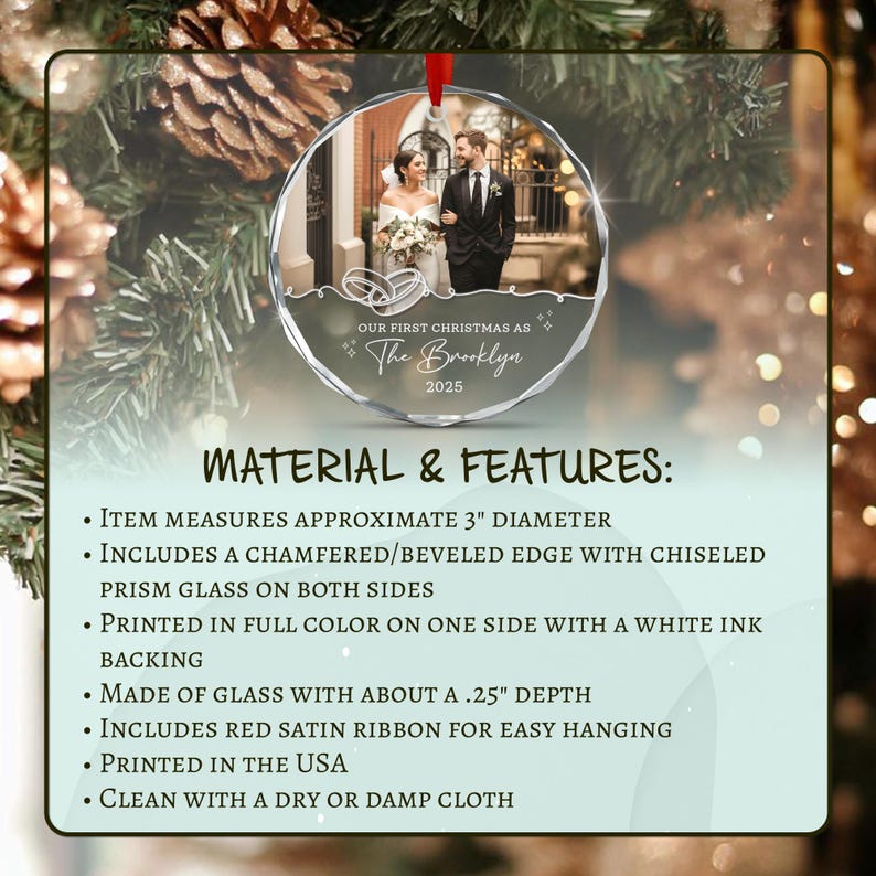 A circular glass Christmas ornament featuring a photo of a couple, with the text OUR FIRST CHRISTMAS AS The Brooklyn 2025. It has a 3-inch diameter, beveled edges, and a red satin ribbon.