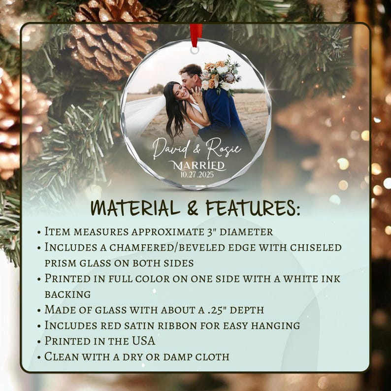 A circular glass ornament with a 3-inch diameter and beveled edges. It features a full-color photograph of a couple, the text David & Rosie MARRIED 10.27.2025, and a red satin ribbon.