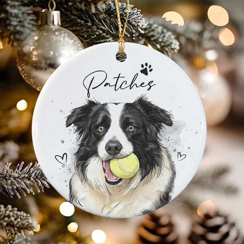 A round white ceramic ornament featuring a black and white Border Collie illustration holding a yellow tennis ball in its mouth.