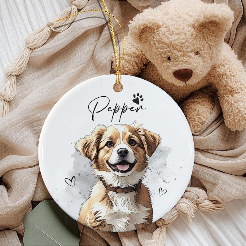 A round white ceramic ornament featuring a colorful illustration of a brown and white dog with a collar.