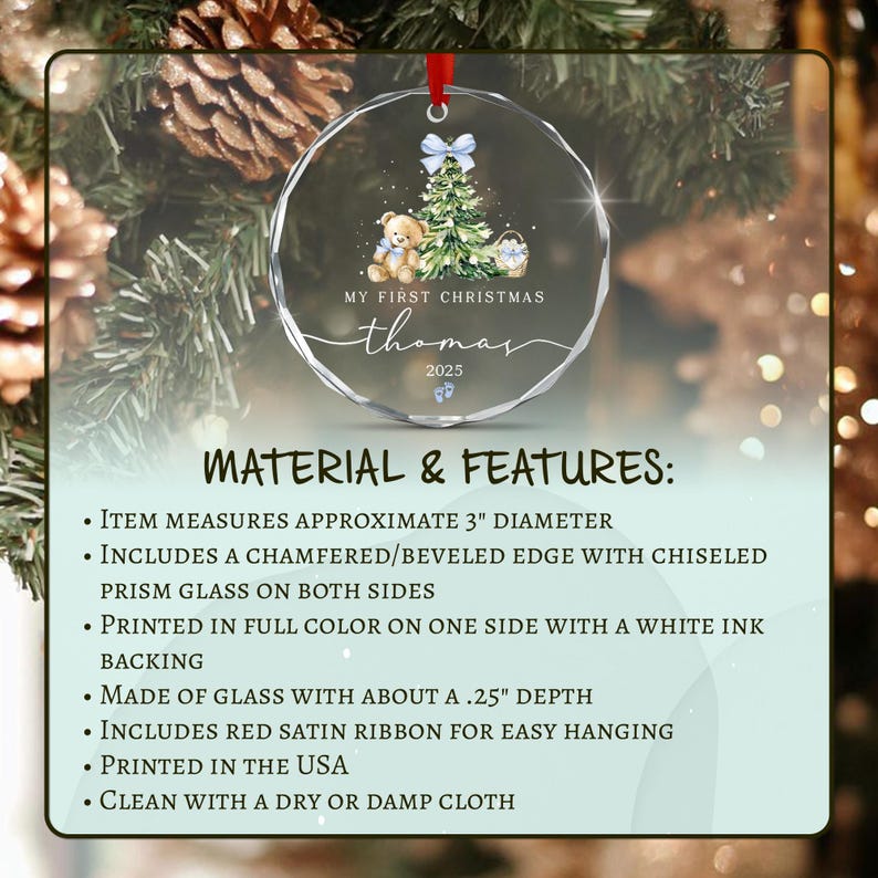 A circular glass Christmas ornament with a 3-inch diameter, featuring a printed design of a teddy bear, a Christmas tree, and the text 'MY FIRST CHRISTMAS thomas 2025'.