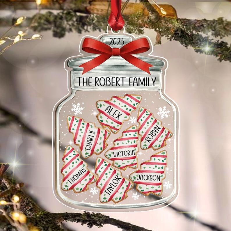 A clear jar-shaped Christmas ornament featuring a red ribbon at the top with the year 2025.