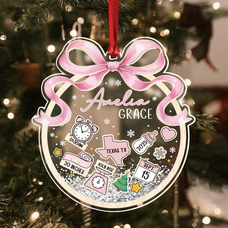 A personalized Christmas ornament with the name "Amelia Grace" in script.