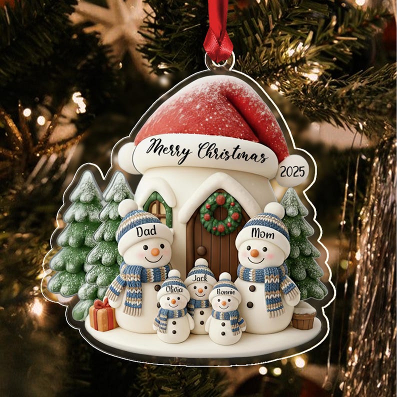 A flat, decorative Christmas ornament featuring a house topped with a red Santa hat, labeled Merry Christmas 2025.