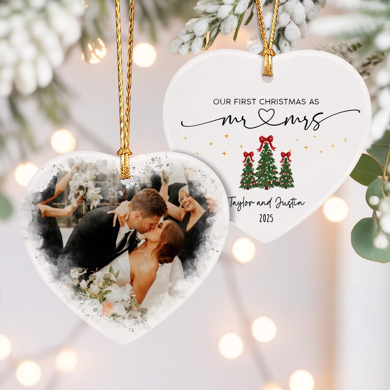 Two heart-shaped ceramic ornaments with gold hanging strings.
