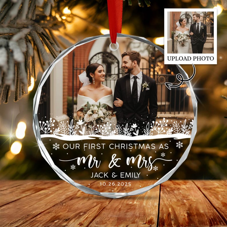 A round, faceted glass Christmas ornament featuring a custom wedding photograph of a couple.