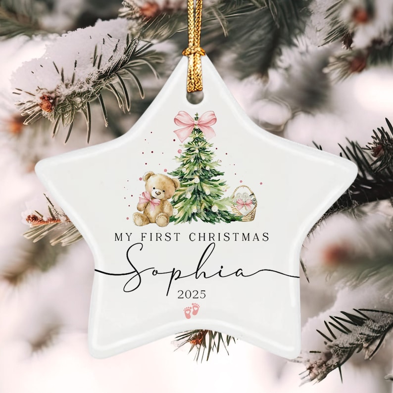 A white star-shaped ceramic ornament featuring a watercolor illustration of a teddy bear, a Christmas tree with a pink bow, and a basket.