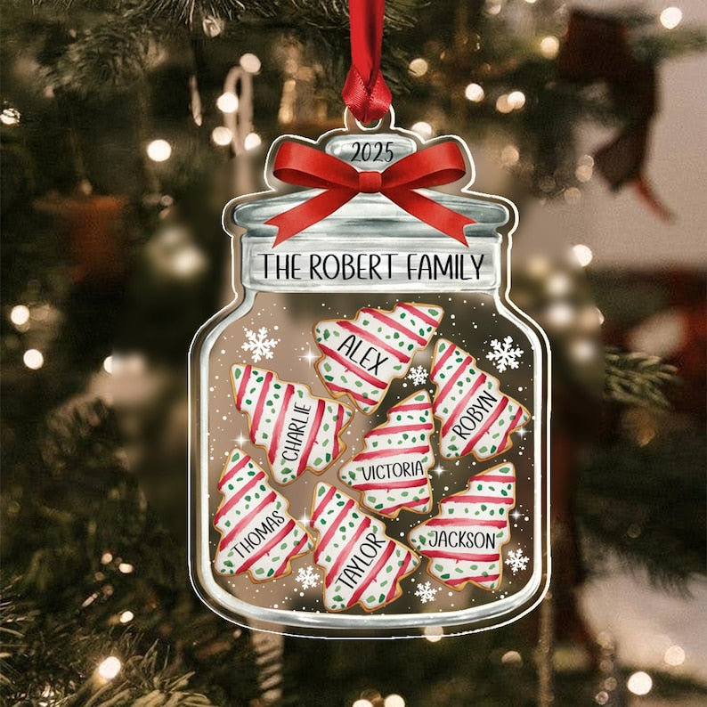 A clear jar-shaped Christmas ornament featuring a red ribbon at the top with the year 2025.
