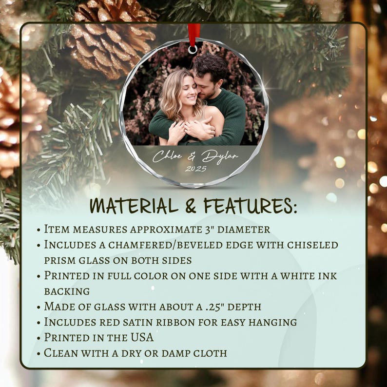 A circular glass ornament featuring a photograph of a couple, with the text Chloe & Dylan 2025. It has a 3-inch diameter, a beveled edge, and a red satin ribbon.