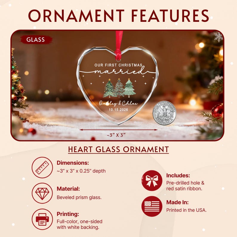 A heart-shaped beveled glass ornament featuring the text "OUR FIRST CHRISTMAS married" and "Ashley & Chloe 10.15.2026" with three green trees. It includes a red satin ribbon and measures approximately 3 inches by 3 inches.