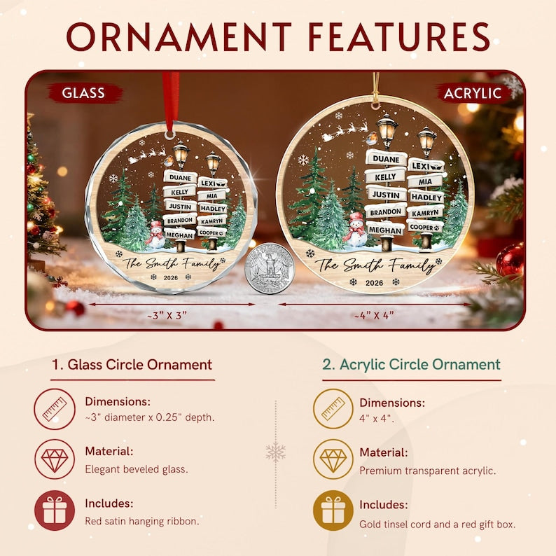 Two circular Christmas ornaments, one glass and one acrylic, featuring a winter scene with street signs listing names, a snowman, and pine trees.