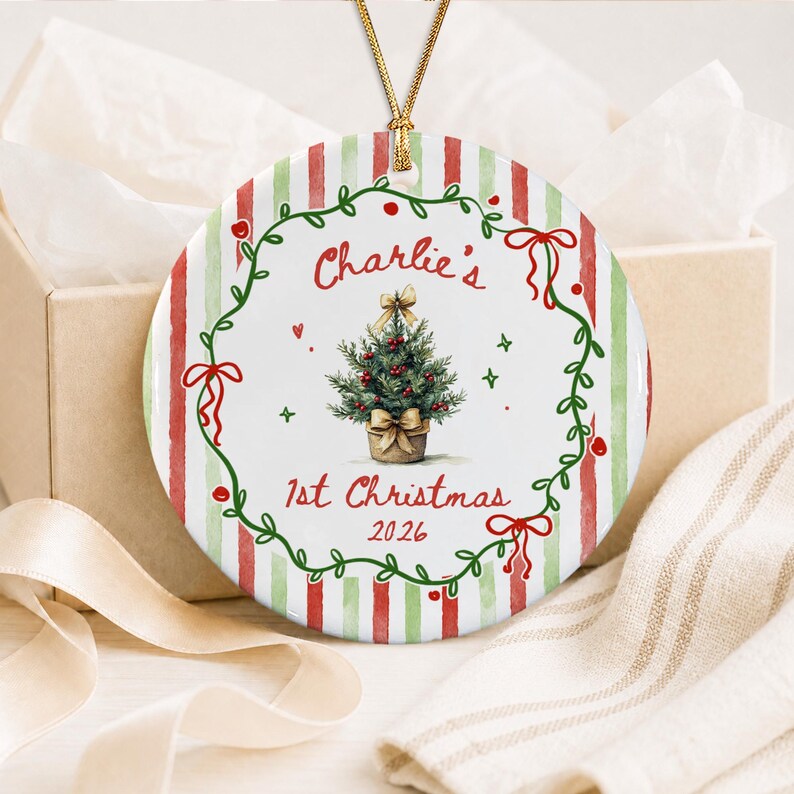 A round ceramic Christmas ornament featuring a red and green striped background.