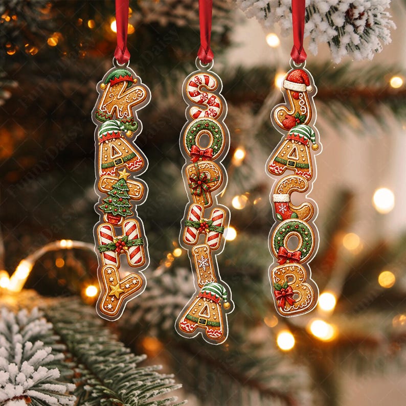 Three vertical Christmas ornaments featuring gingerbread-style letters spelling the names KATHY, SOPHIA, and JACOB.