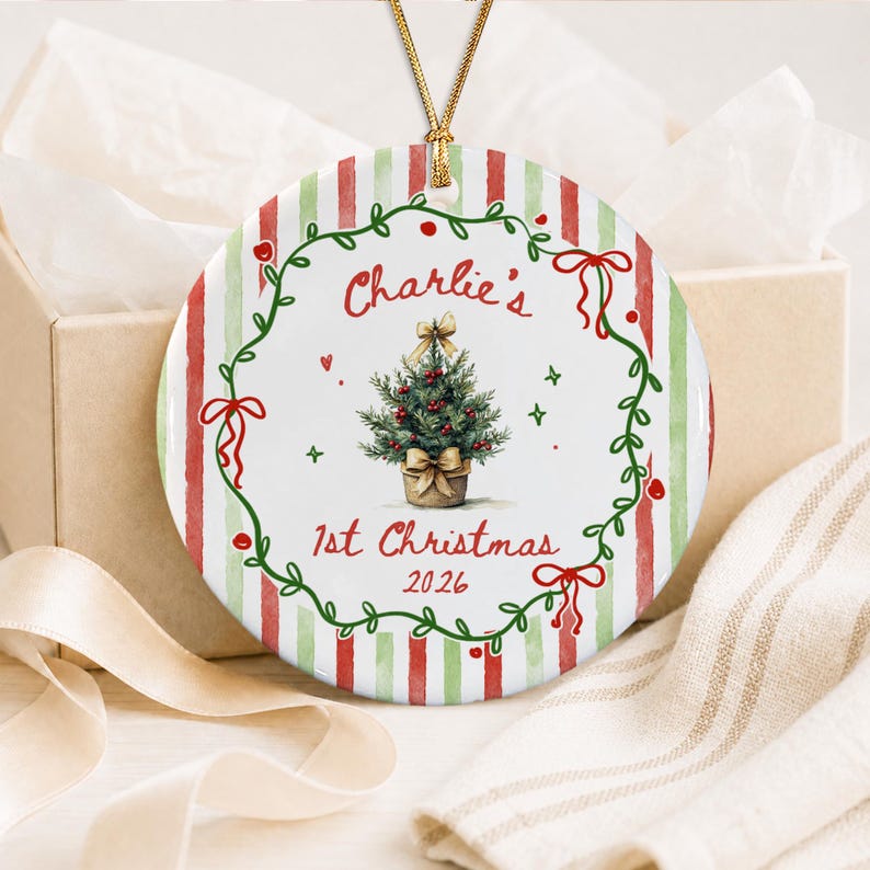 A round ceramic Christmas ornament featuring a red and green striped background.