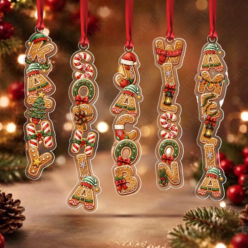 Five vertical Christmas ornaments shaped like gingerbread cookies, each featuring a name spelled out in cookie letters: KATHY, SOPHIA, JACOB, WILSON, and AMELIA.