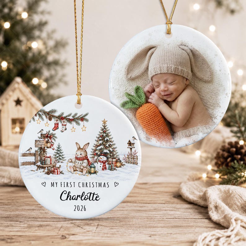 Two round white ceramic ornaments with gold hanging strings. One features a photo of a baby in a bunny hat holding a crocheted carrot.