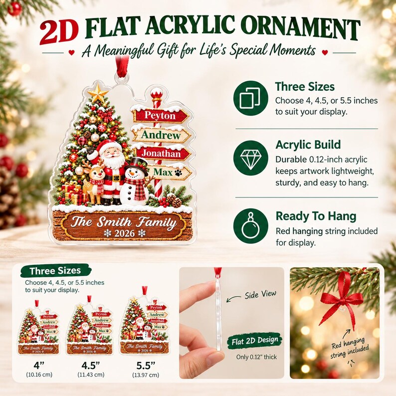 A 2D flat acrylic Christmas ornament featuring a decorated tree, Santa Claus, a reindeer, and a snowman. It includes a signpost with names, a base labeled The Smith Family 2026, and a red hanging string.