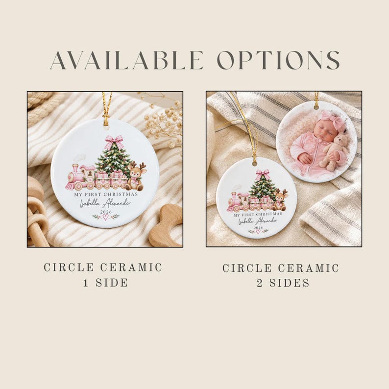 Two white circular ceramic ornaments with gold hanging strings. One shows a pink train, Christmas tree, and reindeer with text My First Christmas Isabella Alexander 2026. The other shows the same design plus a photo of a baby.