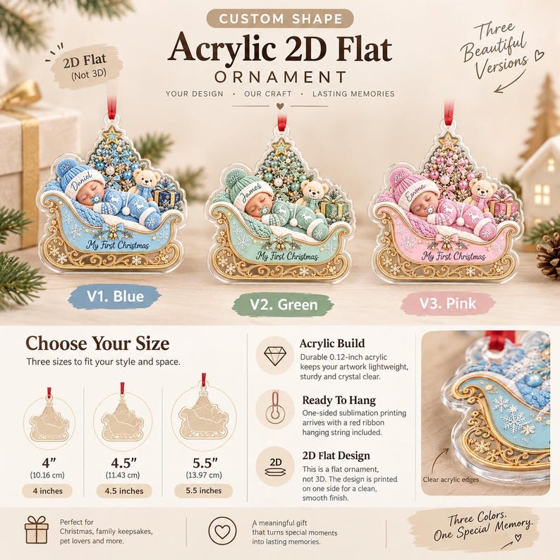 Three custom shape acrylic 2D flat ornaments featuring a sleeping baby in a sleigh with a Christmas tree and teddy bear. Available in blue, green, or pink, with text reading My First Christmas.